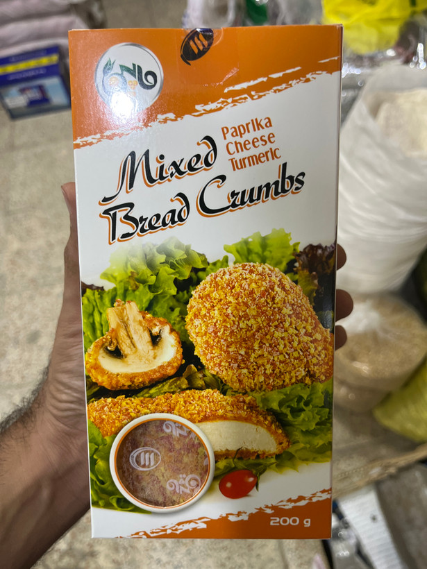 پودر سوخاری مخلوط ۲۰۰ گرمی با نوشتههای پاپریکا، پنیر و زردچوبه روی بسته